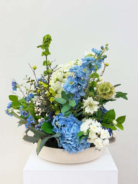 Garden-Inspired Blue Hydrangea & Delphinium Arrangement in Contemporary Ceramic Bowl